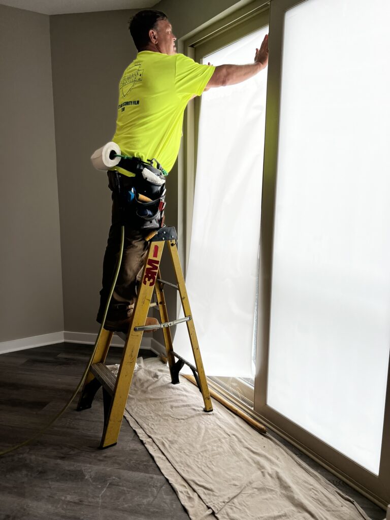 Installing 3M Fasara Privacy Window Film – Student Housing, Tampa FL Technician installing 3M Fasara privacy window film in Tampa student housing to enhance privacy and comfort.
