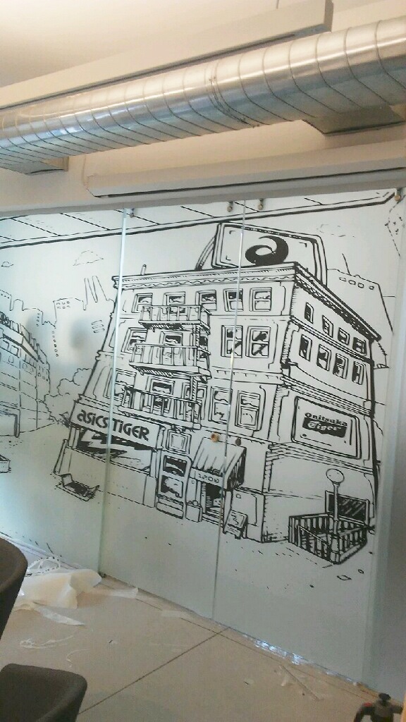 ASICS Pop-Up Store – Custom Printed Window Film Installation NYC Custom printed window film installation for ASICS pop-up store in New York City by Guardian Bastille, showing partial completion of branded storefront graphics.