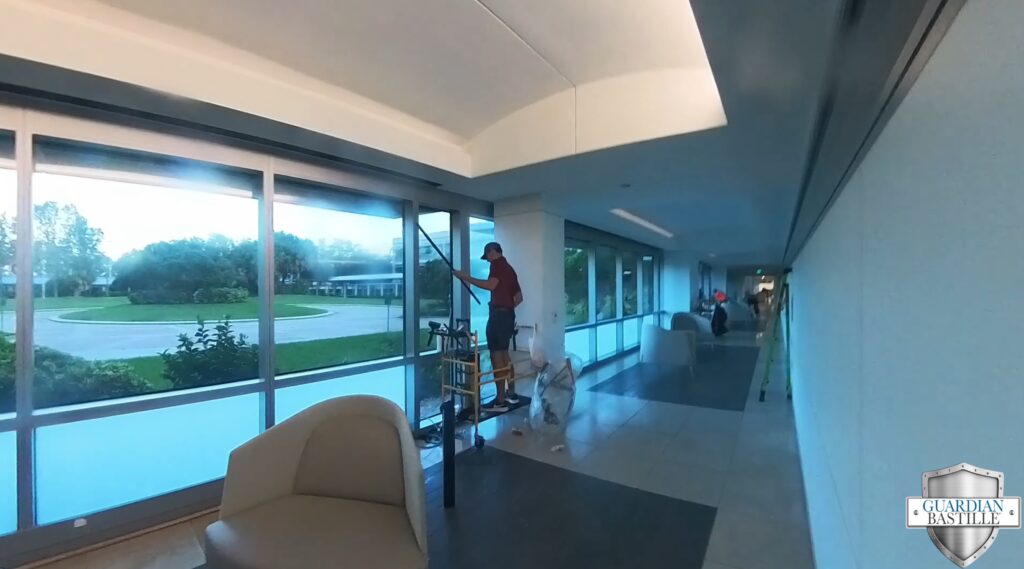 Guardian Bastille installer applying 3M Prestige 50 window film at Citi Call Center Campus Tampa FL