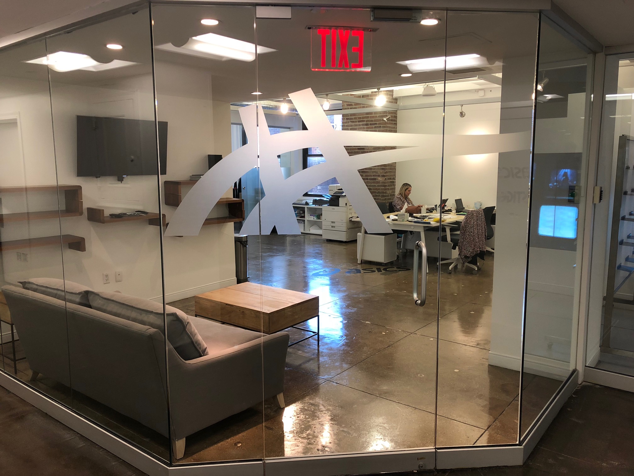 3M Dusted Crystal film with ASICS logo cut into the frosted glass