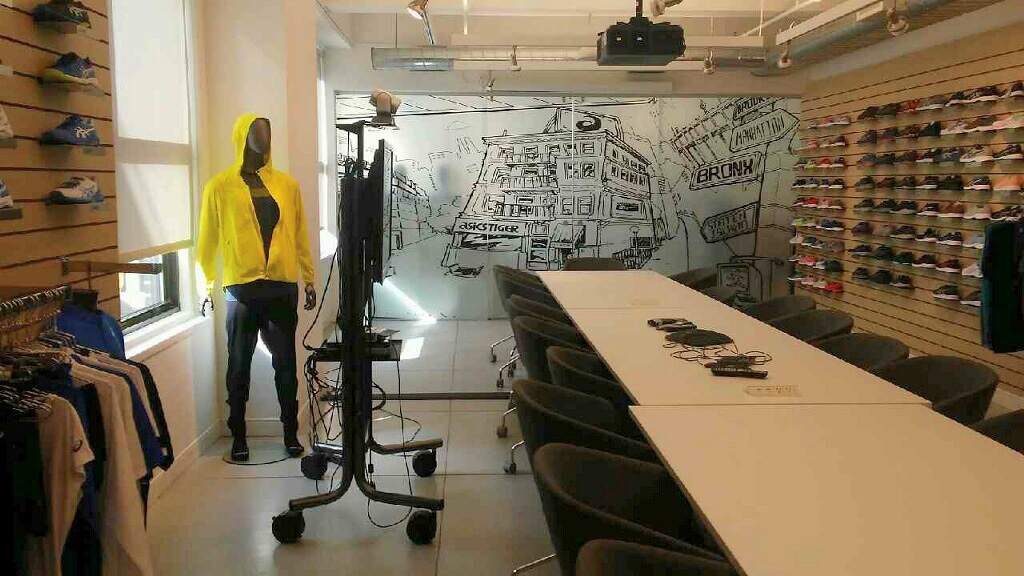 Finished custom printed window film mural in the ASICS showroom