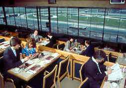 Dining area overlooking the racetrack through floor-to-ceiling glass at the Lincoln, RI venue