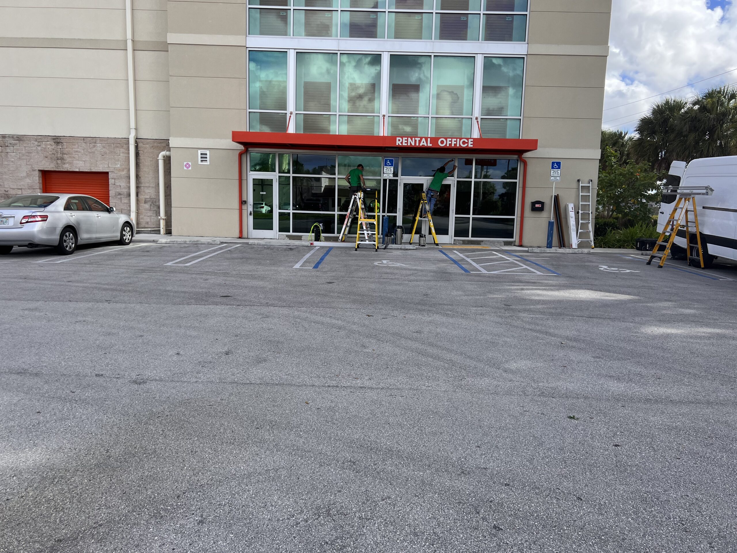 Guardian Bastille technicians installing exterior window film at a Public Storage location