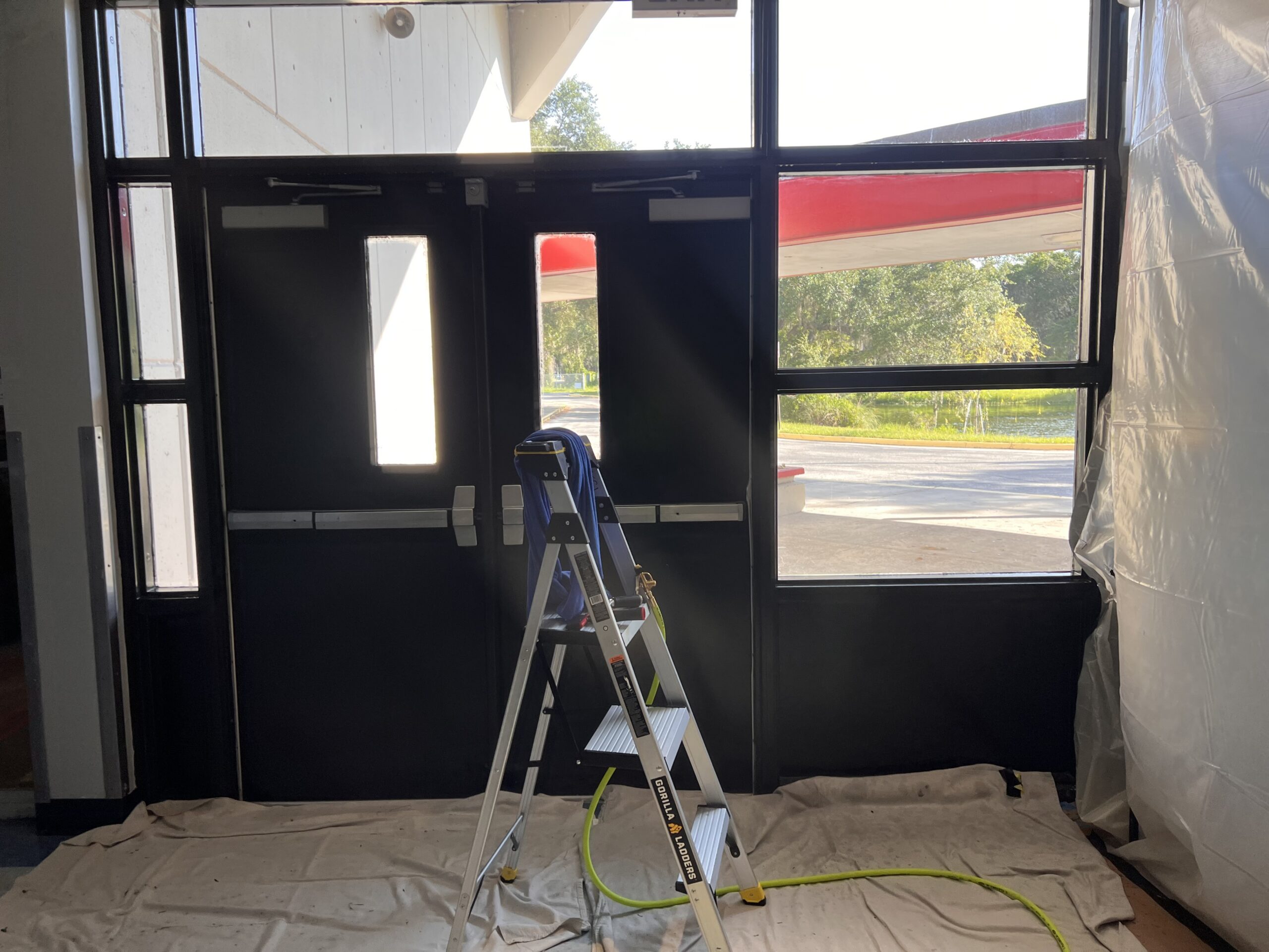 Interior view of tinted glass door and windows at a Public Storage rental office